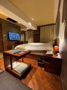 Ένα ή περισσότερα κρεβάτια σε δωμάτιο στο Hotel Venus Neo