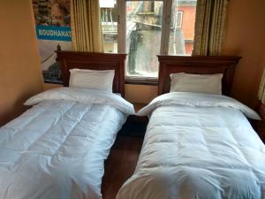 Ένα ή περισσότερα κρεβάτια σε δωμάτιο στο Beehive Hostel Kathmandu