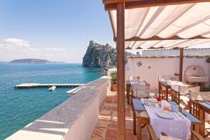 a restaurant with a view of the water at Villa Lieta in Ischia