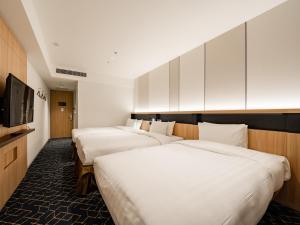 Keio Prelia Hotel Sapporo客房内的一张或多张床位
