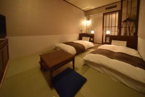 Postel nebo postele na pokoji v ubytování Dormy Inn Premium Otaru