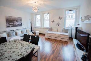 a living room with a couch and a table at Ferienparadies in Fürth