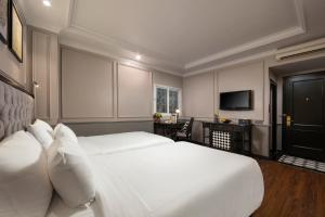Ένα ή περισσότερα κρεβάτια σε δωμάτιο στο Imperial Hotel & Spa
