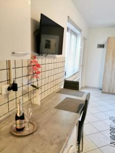 a bottle of wine sitting on a table in a room at Studio Sonja in Piran