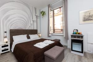 Ένα ή περισσότερα κρεβάτια σε δωμάτιο στο Termini Central Inn