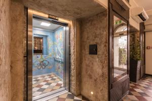 a room with a door and a wall with graffiti at Hotel Ester in Kraków