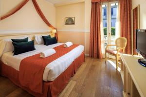 Ein Bett oder Betten in einem Zimmer der Unterkunft Hotel Villa Carlotta