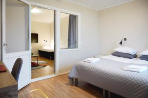 Postel nebo postele na pokoji v ubytování Hotell Vesterhavet