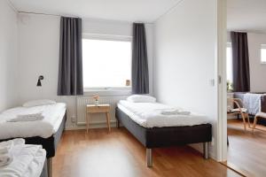Postel nebo postele na pokoji v ubytování Hotell Vesterhavet