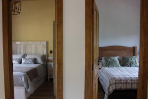 Postel nebo postele na pokoji v ubytování CABAÑA DE LA ABUELA DE SELAYA