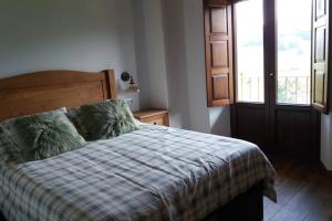 Postel nebo postele na pokoji v ubytování CABAÑA DE LA ABUELA DE SELAYA