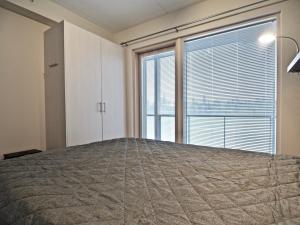 Postel nebo postele na pokoji v ubytování Levillas Tunturinlaita Apartments