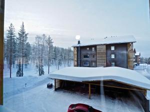 Levillas Tunturinlaita Apartments v zimě