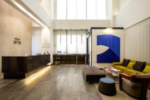 a living room with a couch and a table at Hotel Arte in Suwon