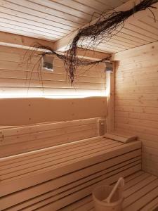 a sauna with a light on the inside of it at Hotel Toč in Lipova Lazne