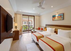 Letto o letti in una camera di Sobit Sarovar Portico