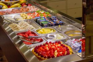 a buffet filled with different types of food at Hotel Maioli in Misano Adriatico