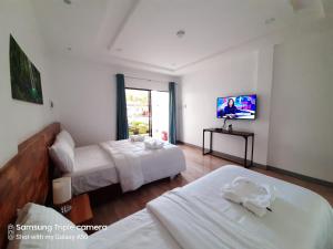 Кровать или кровати в номере Chinita Boutique Hotel