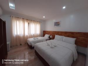 Кровать или кровати в номере Chinita Boutique Hotel