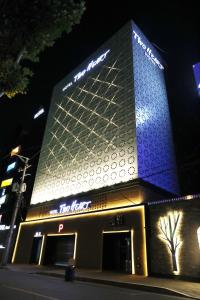 a building with a sign on the side of it at Hotel Two Heart in Daegu