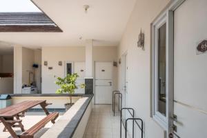 a kitchen and dining room with a table and chairs at Koolkost near Stikes Cirebon in Cirebon