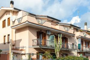 a building with balconies on the side of it at Plaza Rooms Ciampino in Ciampino