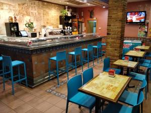 A restaurant or other place to eat at Hostal Restaurante El Surtidor