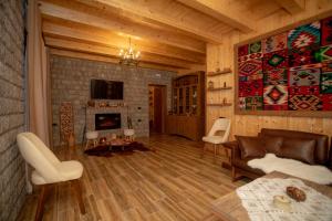 a living room with a couch and a fireplace at OLD HOUSE in Shkodër