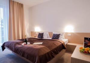 Posteľ alebo postele v izbe v ubytovaní ELITE hotel & restaurant Nová Dubnica