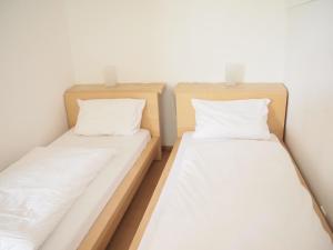 Un pat sau paturi într-o cameră la Apartements im TSB Sportpark