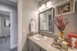 a bathroom with a sink and a vase with flowers at Quiet Home by Dtwn Livingston Hike, Fish and Ski! in Livingston +21 photos