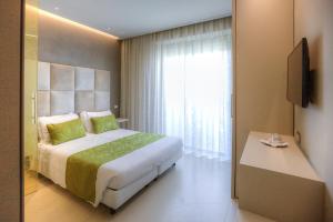Postel nebo postele na pokoji v ubytování Hotel Nettuno