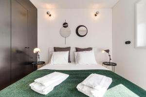 a bedroom with a large bed with two white pillows at Nomad's Family - 2BED Spacious Apartment Gaia in Vila Nova de Gaia