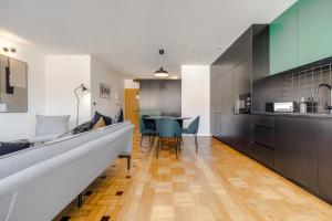 a kitchen and dining room with a table and chairs at Nomad's Family - 2BED Spacious Apartment Gaia in Vila Nova de Gaia