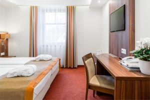 Voodi või voodid majutusasutuse Bükkös Hotel & Spa toas