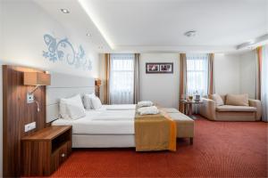 Кровать или кровати в номере Bükkös Hotel & Spa