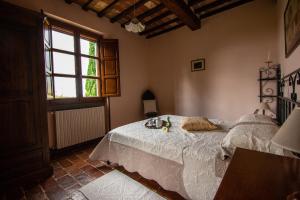 Кровать или кровати в номере Collina dei Fiori