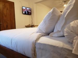 Postel nebo postele na pokoji v ubytování SATRANA HOTEL TAMATAVE