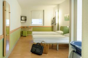 Ein Bett oder Betten in einem Zimmer der Unterkunft Ibis budget Wien Sankt Marx
