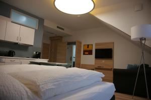Postel nebo postele na pokoji v ubytování Leister Apparthotel