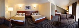 מיטה או מיטות בחדר ב-Hotel 4x4