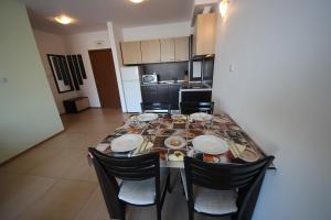 A kitchen or kitchenette at Menada Grand Kamelia Apartments