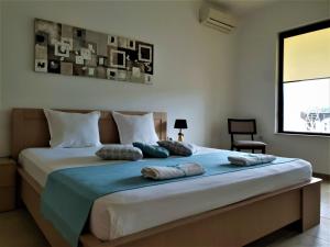 Tempat tidur dalam kamar di St George Apartcomplex