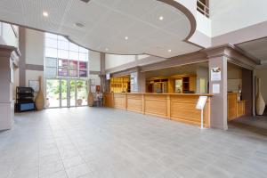 a large room with a lobby with a counter at Village Pierre & Vacances Moliets in Moliets-et-Maa