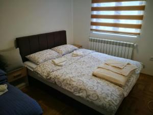 Postel nebo postele na pokoji v ubytování Vila Meridijan