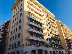 a tall building with balconies on the side of it at Apartment Bruno's in Rome