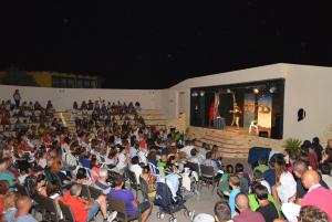 a crowd of people watching a man on a stage at Nirvana Club Village in Botricello +155 photos