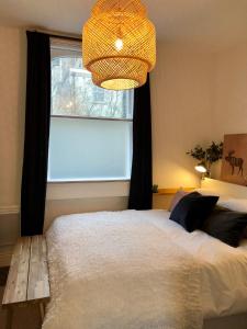 Krevet ili kreveti u jedinici u okviru objekta Cosy centrally located one bedroom flat