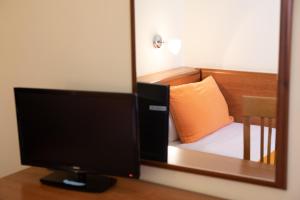TV a/nebo společenská místnost v ubytování Hotel Merlino