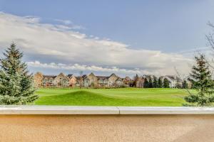 a view of a golf course with houses at Wintergreen 218 in Blue Mountains